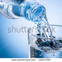 stock-photo-pouring-water-from-bottle-into-glass-on-blue-background-146471507